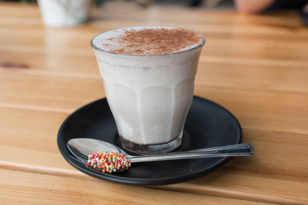 istock Chai latte in glass mug at cafe 1128385840