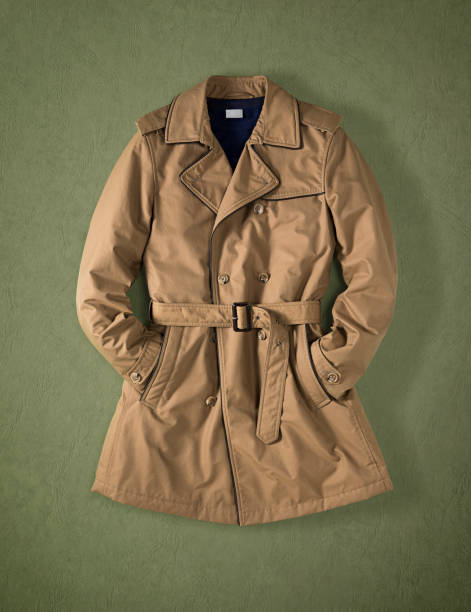 brown trench coat isolated on green background - waistband imagens e fotografias de stock