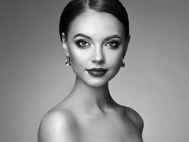istock Beautiful woman face with perfect makeup 1128385932
