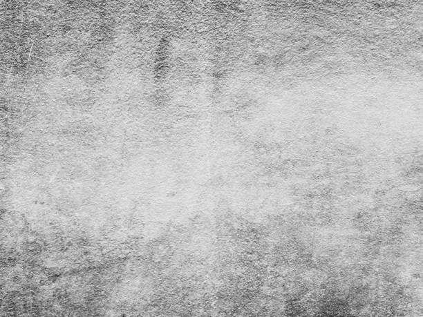 istock Weathered and dirty concrete wall texture background in black and white. 1128386017