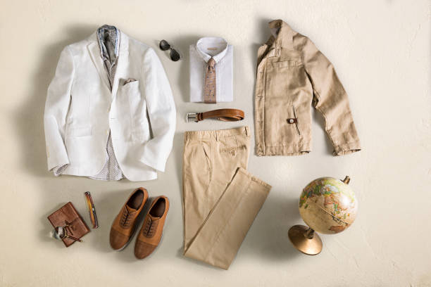 istock Men’s clothing with personal accesorries isolated on beige background 1128387021