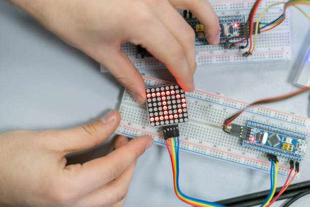 istock close up person work on silicon chip or microcontoller b 1128387189