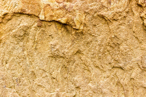 istock Treated natural stone. Not smooth rough surface of solid natural material. Background sandstone. 1128388006