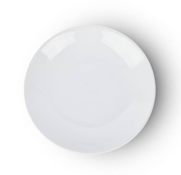 istock Top view of empty white plate on white background 1128390315
