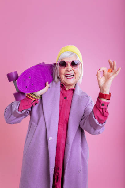 istock Elderly lady feeling truly satisfied after riding skateboard 1128391679