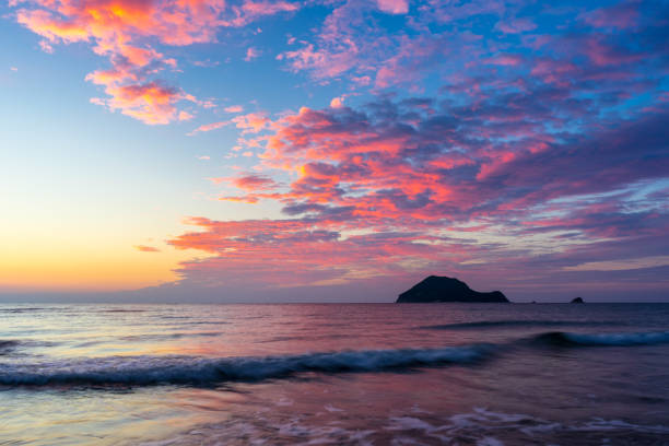 istock Greece, Zakynthos, Glowing red sky over reflecting ocean water and turtle island 1128392064