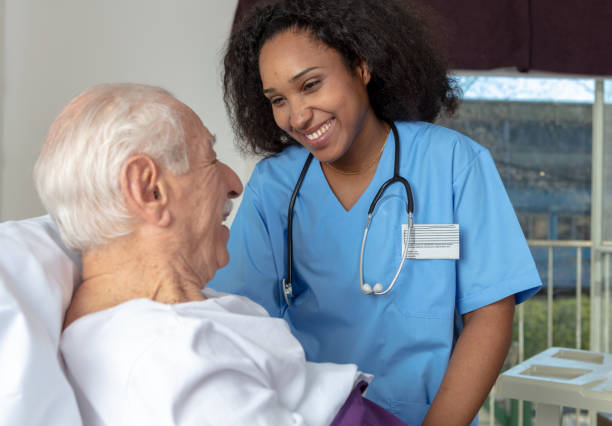 istock Nurse smiling at the patient lying in bed 1128392980