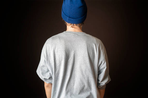 istock young man show gis shirt copy space. casual mock up design b 1128393911