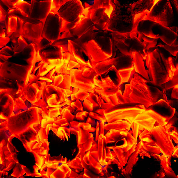 istock Glowing Hot Charcoal Briquettes Close-up Background Texture 1128394387
