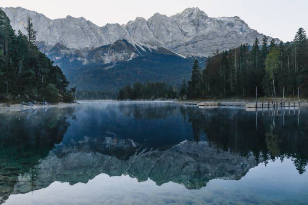 istock mountain lake Eibsee in Bavarian Alps in the morning with reflection, Germany 1128394436