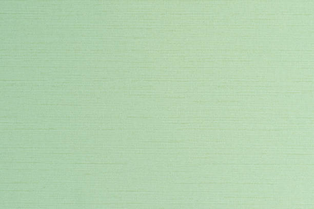 istock Blended cotton silk fabric textile wallpaper detailed texture pattern background in light yellow lime green color 1128395236
