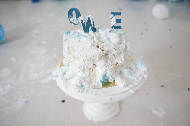 istock Smashed first birthday cake. Smash cake. One year. Blue colour. 1128395579