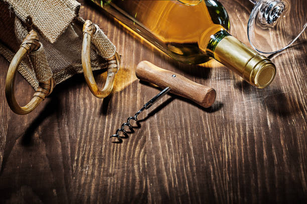 istock bottle of white wine burlap bag corckscrew glass 1128396712