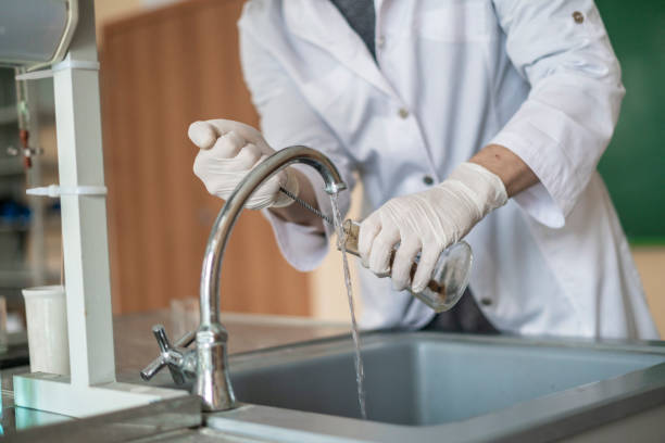 istock young student conduct experiments in universitu in laboratory b 1128397397