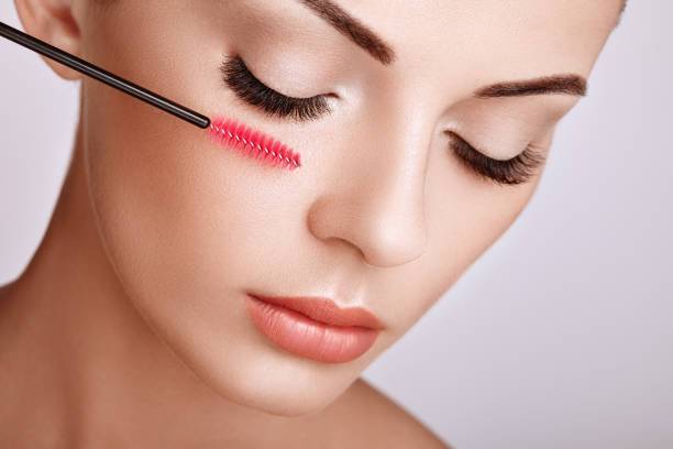 istock Beautiful woman with long false eyelashes 1128401408