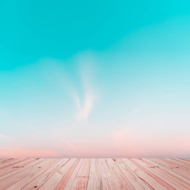 istock Abstract gradient sunrise in the sky with old wood floor background. 1128403821