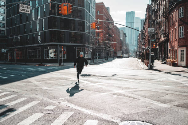 istock Strong man runner training and running through urban streets. Athlete prepearing for marathone on New Your streets 1128404917