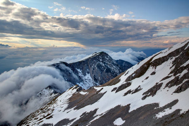 istock Cloud waterfall of low level orographic clouds flowing down Karavanke Karawanken range at sunset from Stol Hochstuhl peak, Karnten Austria / Gorenjska Kranjska Carniola Slovenia Central Europe 1128406622