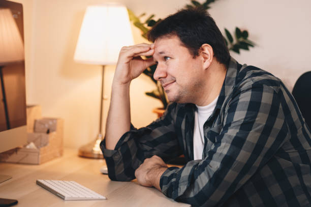 istock Serious young male freelancer working from home office 1128407608