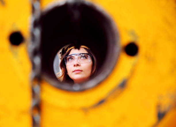istock Young woman working in factory 1128409151