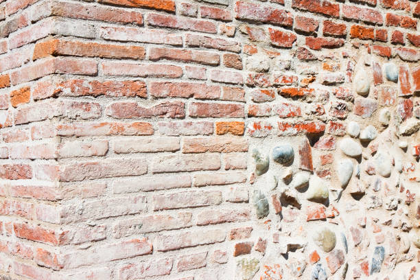 istock Typical Tuscany brick and stone wall recently restored (Italy) 1128410595