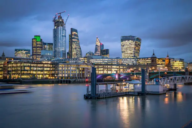 Colour image of the busy London’s skyline including all iconic buildings into the city as photographed from the River Thames Southbank. Picture is ideal for background with extra copy space. All financial district buildings of London City and its ultra modern contemporary buildings as: Fenchurch 42, the Grinder .Stot on Canon EOS R full frame system.