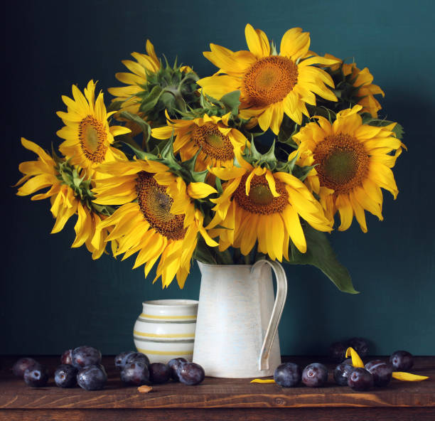 istock bouquet of sunflowers and plums 1128410856