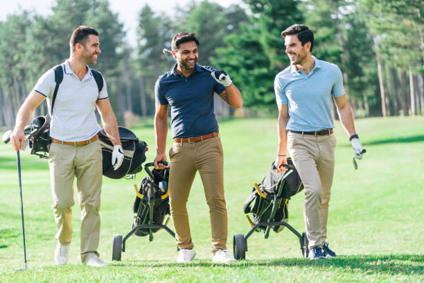 istock Friends Playing Golf on a Beautiful Sunny Day 1128412070