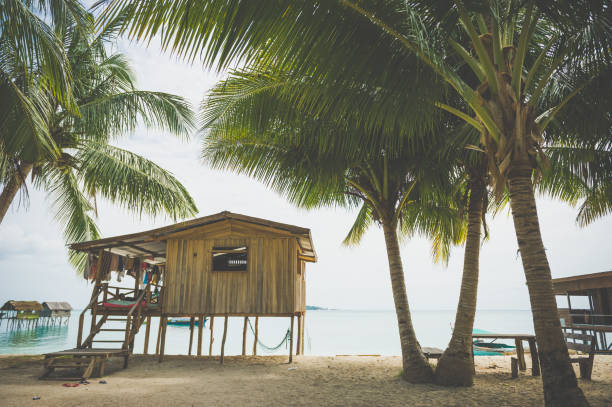 Colorful bungalow or cabana on an island off the coast of Belize, Central America.
