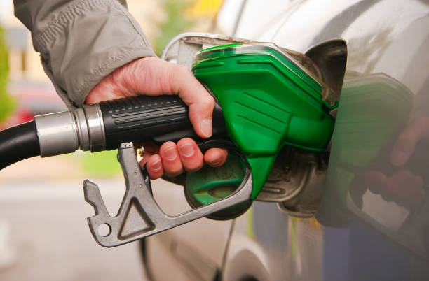 istock male hand refilling the car 1128419228