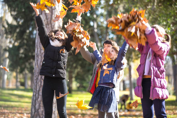 istock Friends in the park with leaves 1128420711