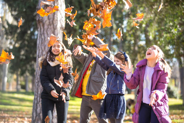 istock Friends in the park with leaves 1128420712