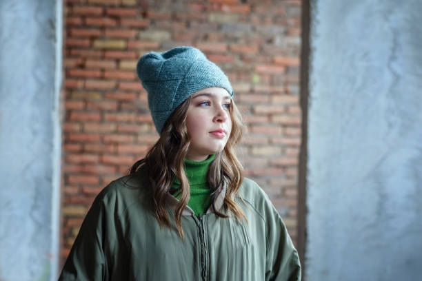 istock young girl in an abandoned building alone 1128424621