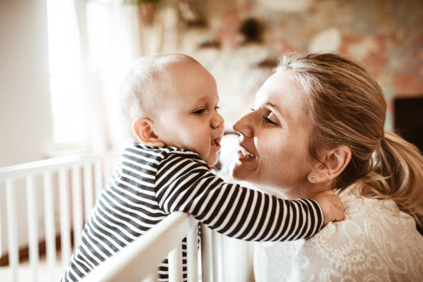 istock little kid in the bed with the mother 1128425924