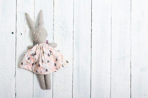 homemade toy rabbit doll, old white wooden table