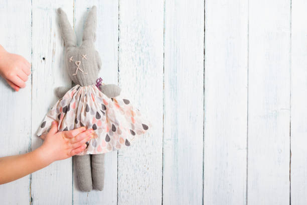 istock Baby hand touch toy rabbit doll 1128427407