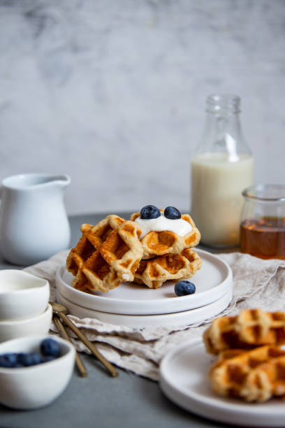 Sweet Homemade Belgian Waffle with Berry and vegan oat milk stock photo