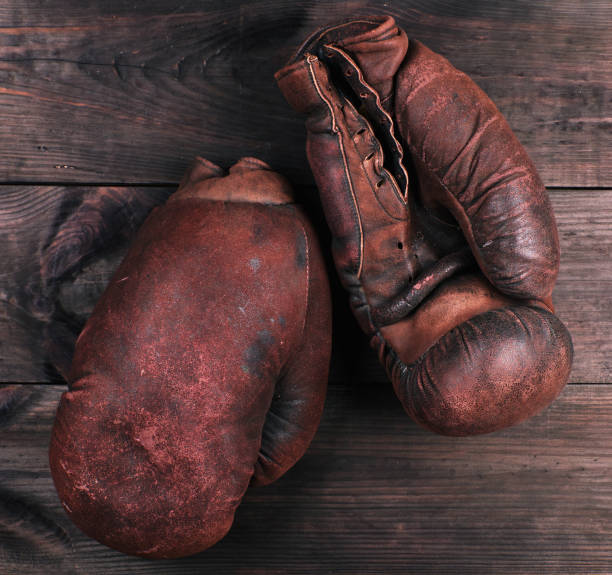 istock very old brown boxing gloves 1128430838