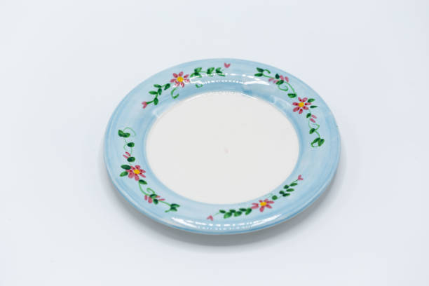 istock small blue and white decorative plate with small flowers on it 1128434028