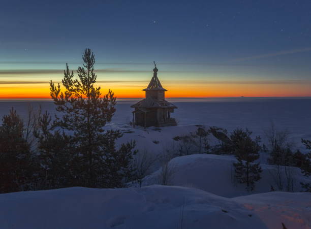 Winter night on Lake Ladoga. church. Winter night on Lake Ladoga. Church on the island. Old wooden architecture. скала stock pictures, royalty-free photos & images