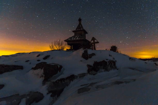 Winter night on Lake Ladoga. church. Winter night on Lake Ladoga. Church on the island. Old wooden architecture. скала stock pictures, royalty-free photos & images