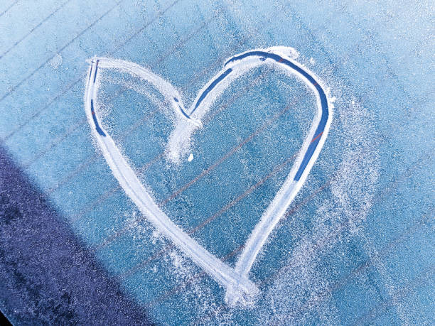 istock A heart scratched into the ice on a windshield 1128436181