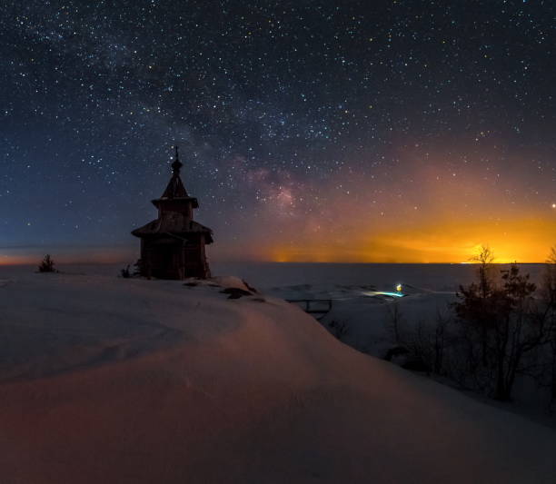 Winter night on Lake Ladoga. church. Winter night on Lake Ladoga. Church on the island. Old wooden architecture. скала stock pictures, royalty-free photos & images