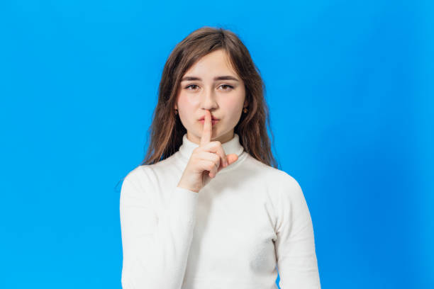 istock Young beautiful girl isolated on blue background 1128436652