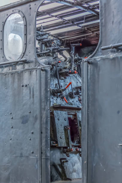 istock Detailed view of a old cab control train, cloudy sky as background 1128437610