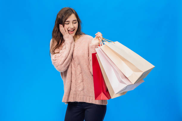 istock Young beautiful girl isolated on blue background 1128437834