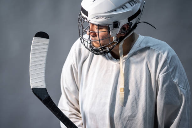 istock Professional ice hockey player Feel angry, one Lighting in dark room. 1128437986