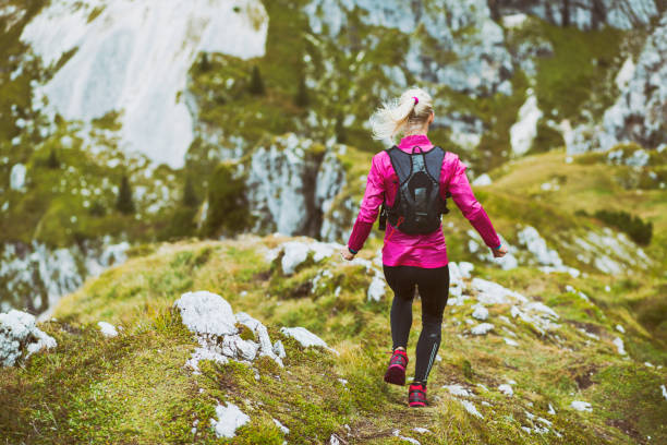 istock Female running in the mountains 1128440739