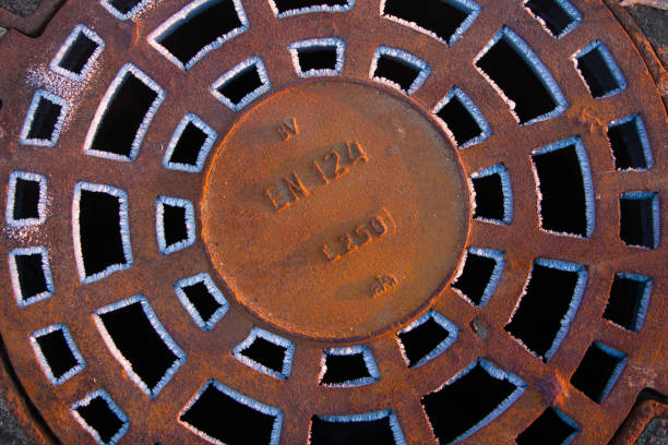 istock manhole on the street 1128442085