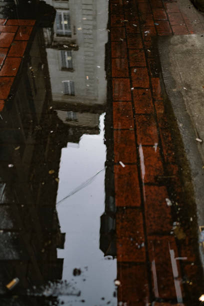 istock Urban puddle reflections, Manchester, England on an overcast February day. 1128442244